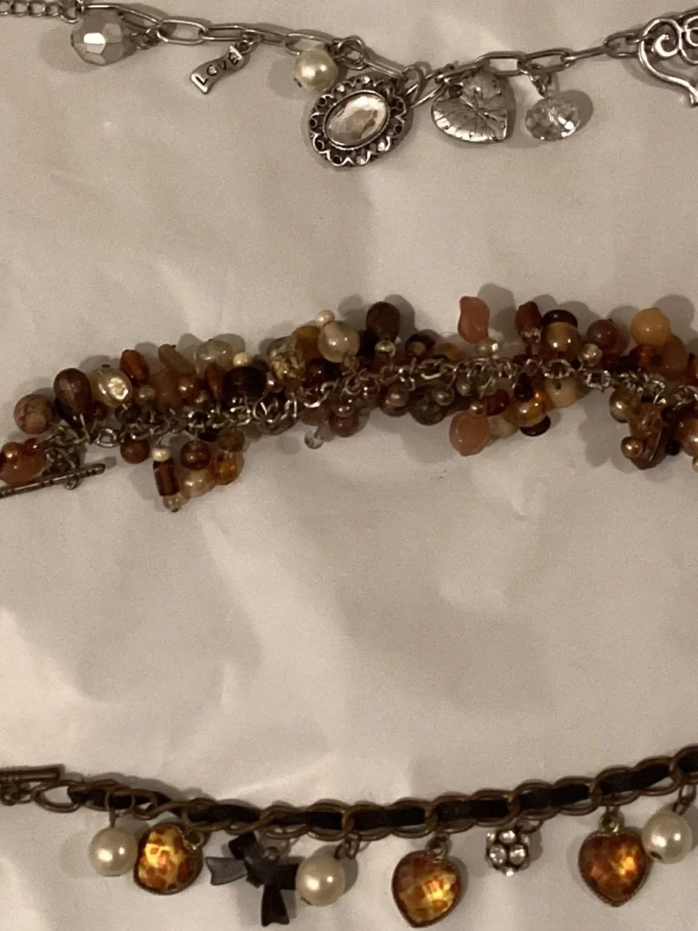 Three charm bead bracelets